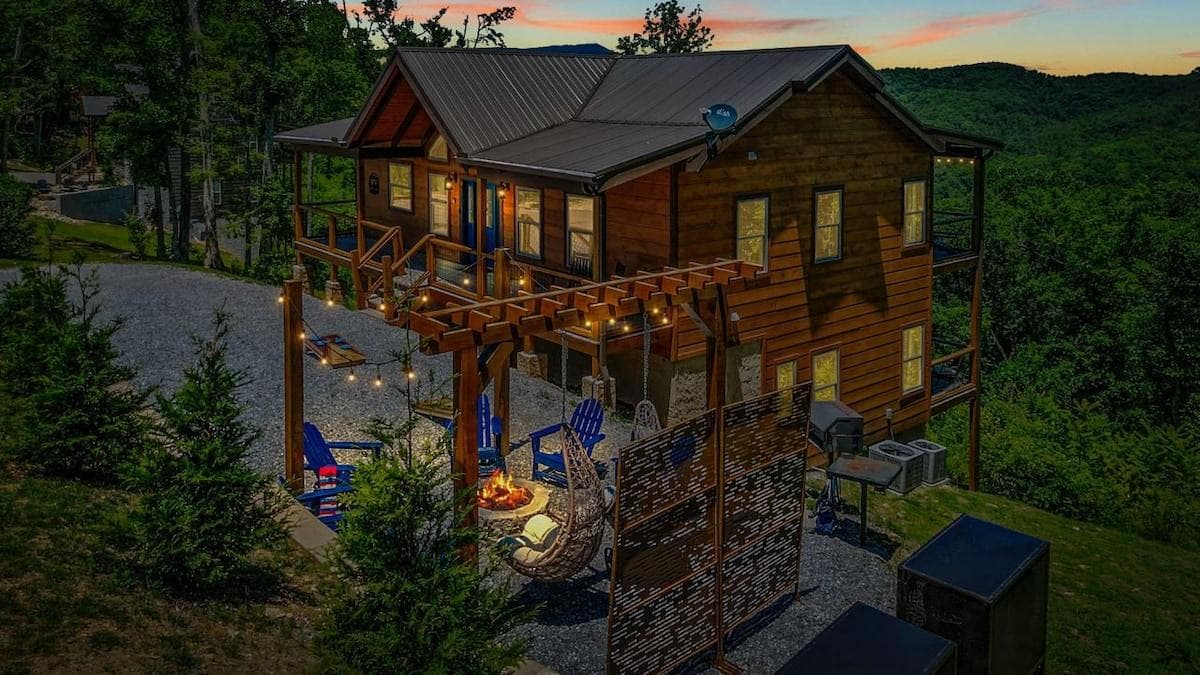 Luxury Cabin within 5 miles of Pigeon Forge Parkway. Features three king suites, mountain views, chef's kitchen, hot tub, game room, bunk beds, and fire pit. Fun for the whole family!